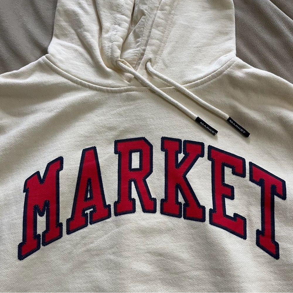 Market Hoodie Size M Cream with Red lettering